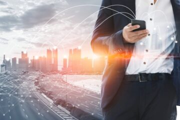 graphic collage of skyline with highway and businessman in foreground